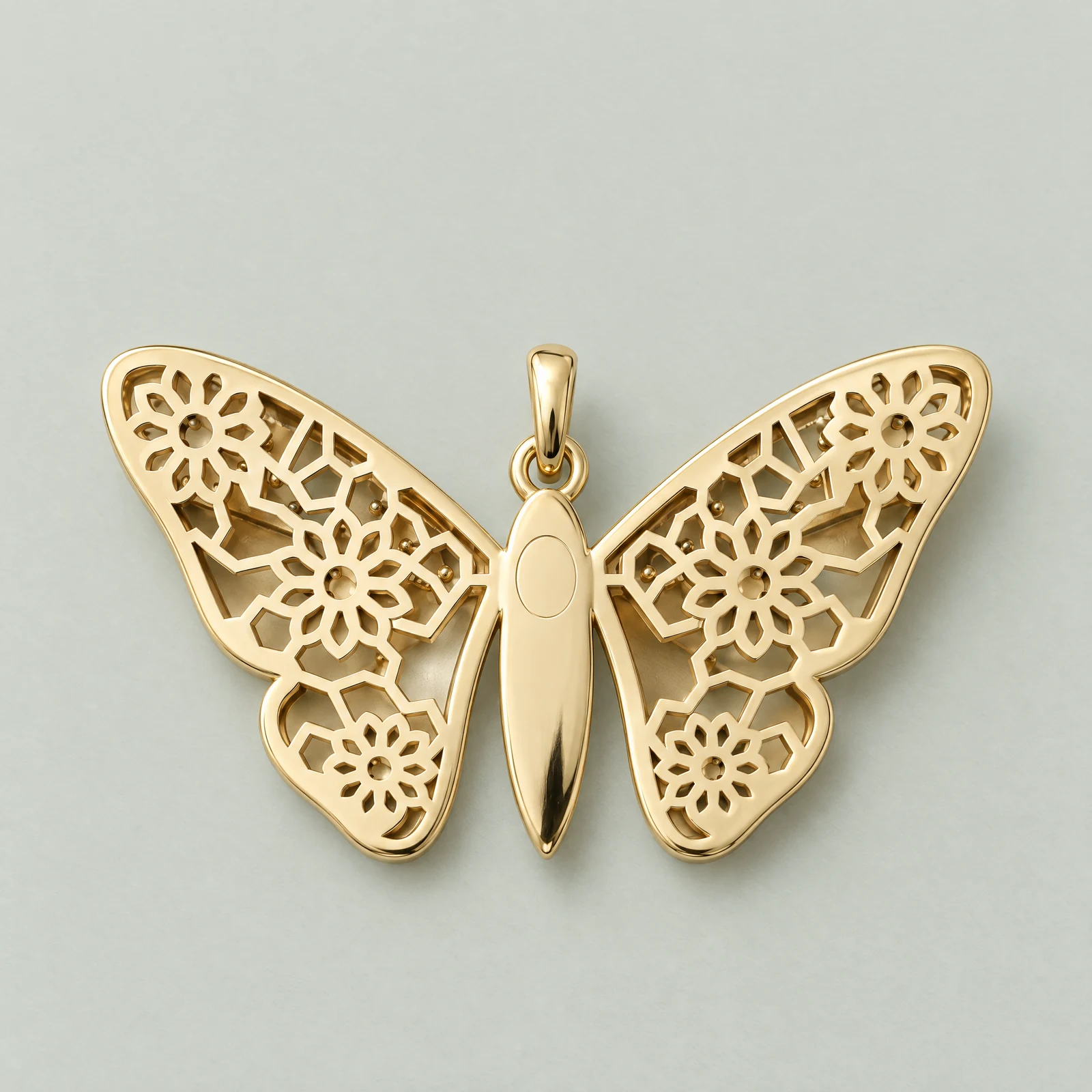 The reverse of the Parvaneh Pendant: a pierced girih backplate of ten-petal rosettes in 18ct yellow gold.